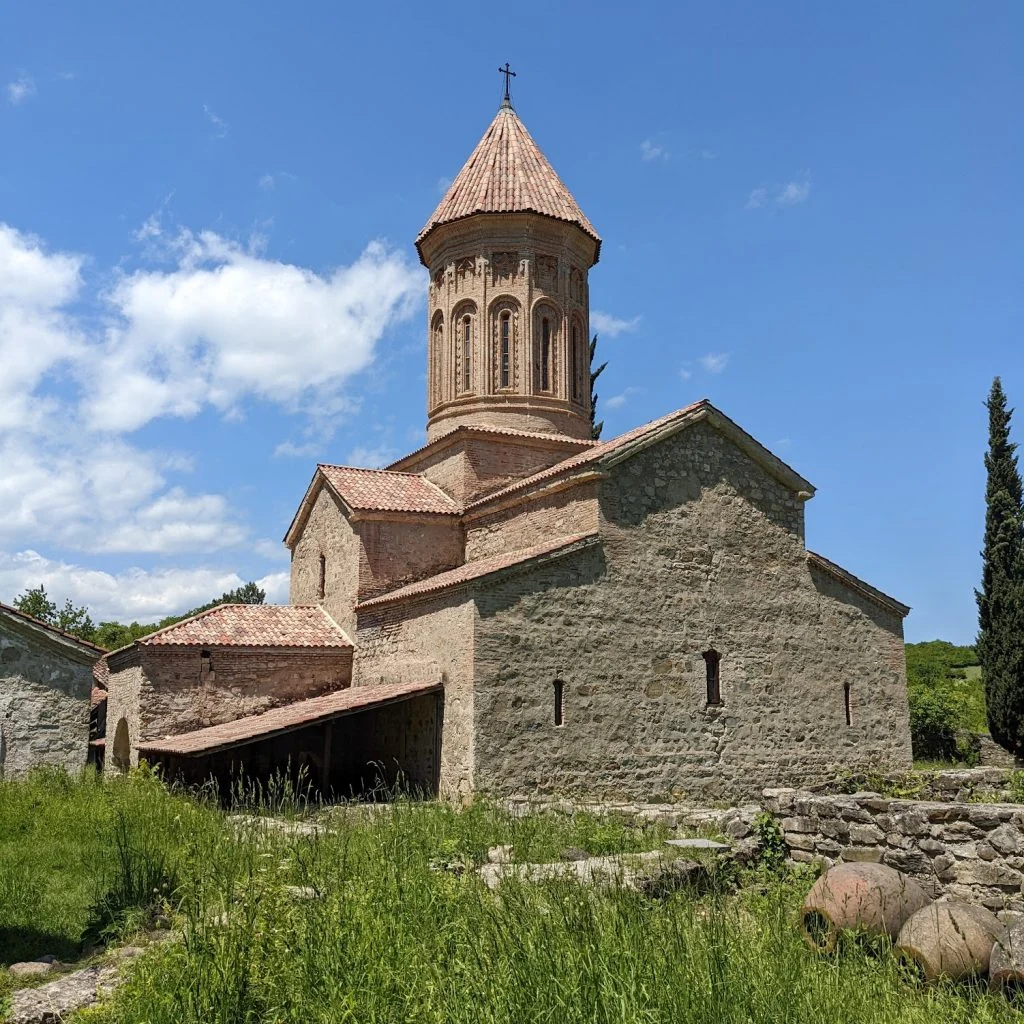 Ikalto monastery Historic stone church under blue sky